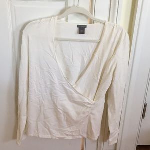 White long sleeve sweater with a wrap in the front